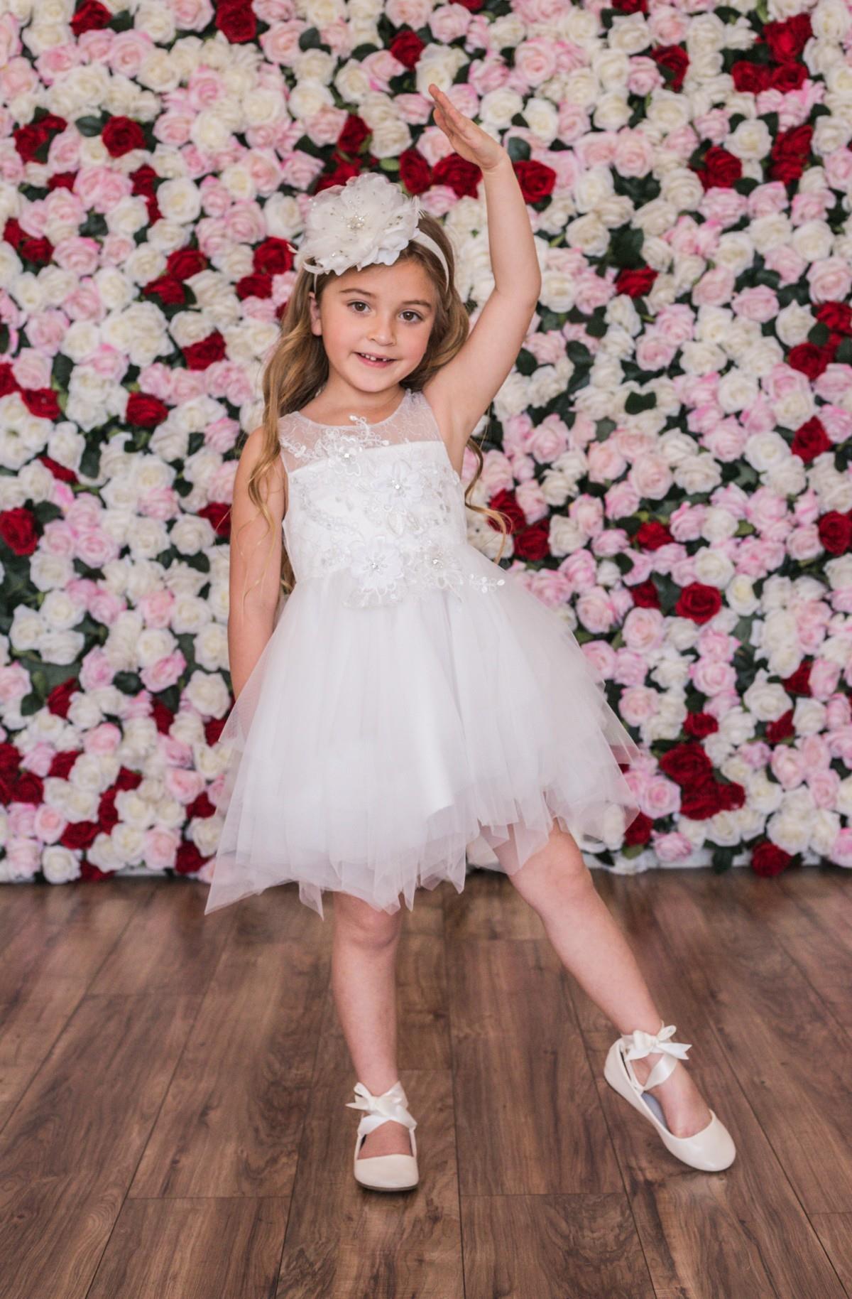 Off-white color, high-low hemline, Emma's Magical Dream, floral bodice with tulle detachable skirt.