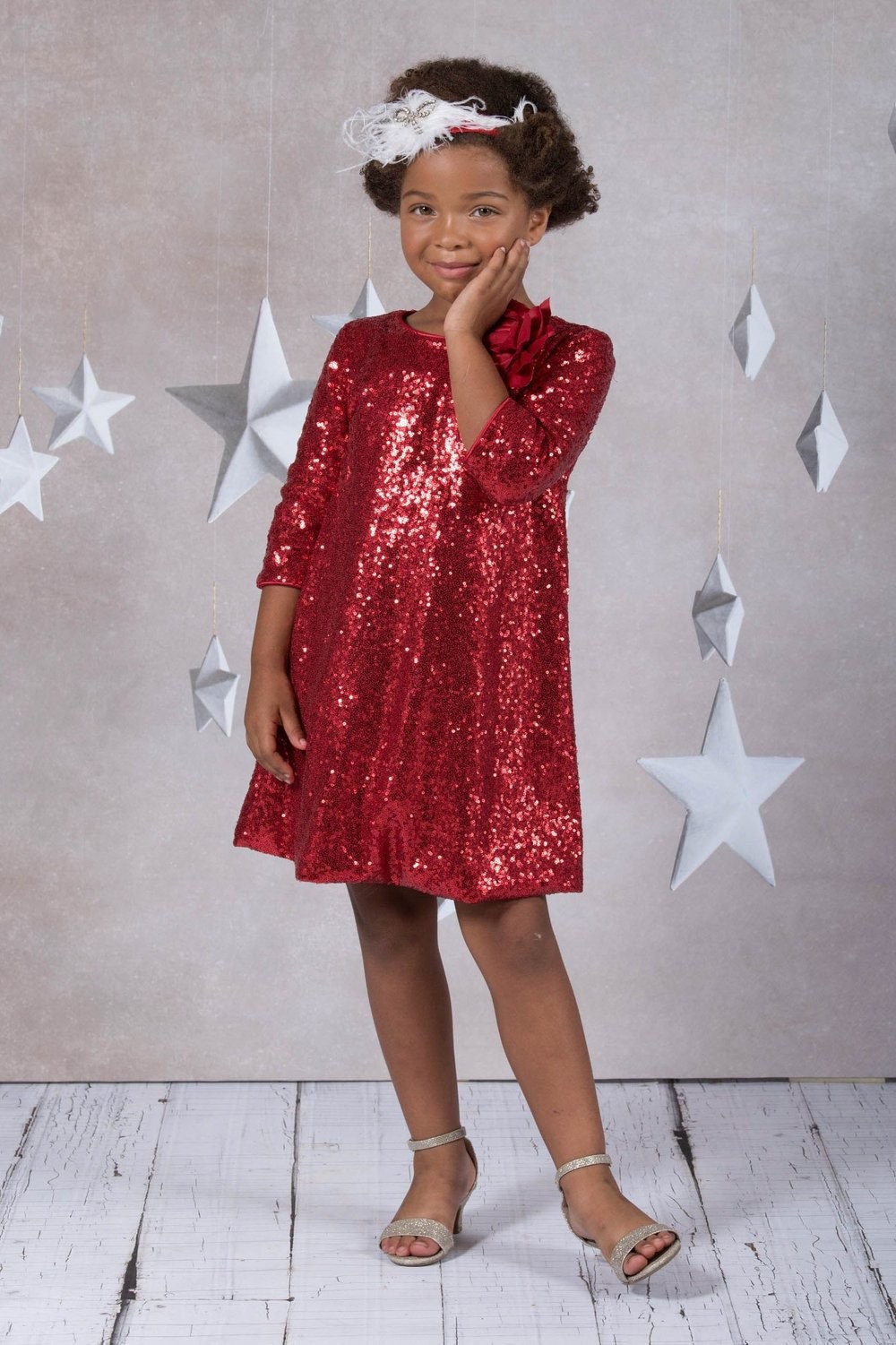 Emma's Magical Dream, sequin sleeve dress with hidden back zipper, removable flower on left shoulder, knee length with 3/4 sleeves, red color