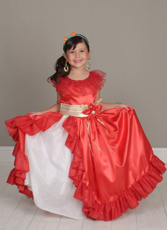 Emma's Magical Dream, Red princess ballgown with a gold tie around the waist and a red flower. It has a white underlay with the jewelry being gold dangle earrings.
