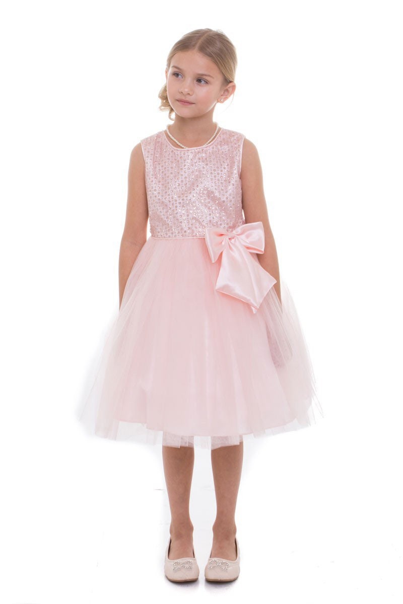 pink sequin dress option with added mesh and silk bow. knee length dress