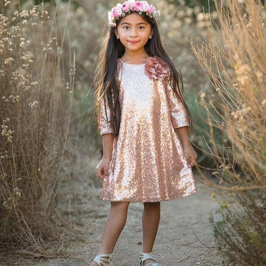 Emma's Magical Dream, sequin sleeve dress with hidden back zipper, removable flower on left shoulder, knee length with 3/4 sleeves, blush color